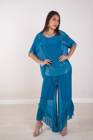 blusa de Hawái coordinada con lentejuelas y pantalones con volantes con lentejuelas y pantalones con lentejuelas y pantalones co