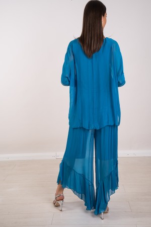 koordinierte Hawaii-Bluse mit Pailletten und Hosen mit koordinierter Hawaii-Blusa-Rüsche mit Pailletten und Hosen mit Rüschen ..