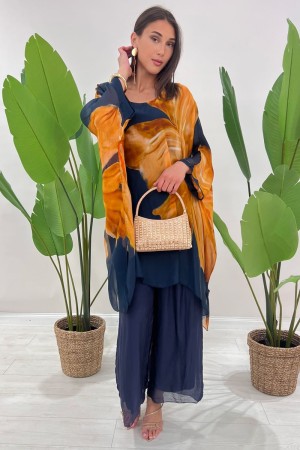 Coordinato Marocco con stampa floreale e pantalone tinta unita Coordinato Marocco con stampa floreale e pantalone tinta unita...