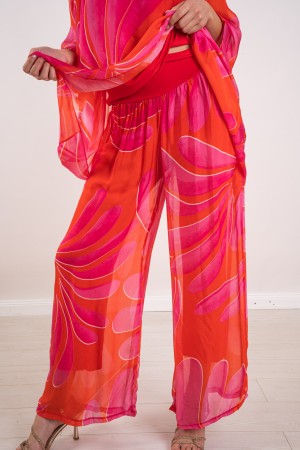 coordinated Veronica in silk blouse and fantasy pants 