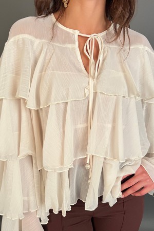 Blusa Elettra con balze in velo e lacci con perle finali Blusa Elettra con balze in velo e lacci con perle finali Blusa Elett...