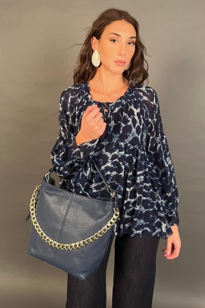 Blusa Violetta con fantasia animalier con maniche a palloncino  Blusa Violetta con fantasia animalier con maniche a palloncin...