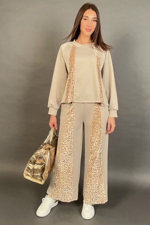 Coordinated in Geneva suit with flat sequin bands tone on tone