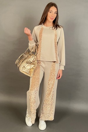 Coordinated in Geneva suit with flat sequin bands tone on tone