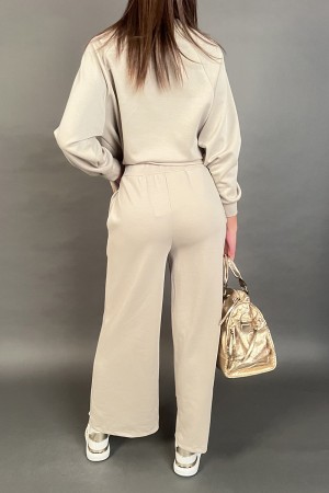 Coordinated in Geneva suit with flat sequin bands tone on tone