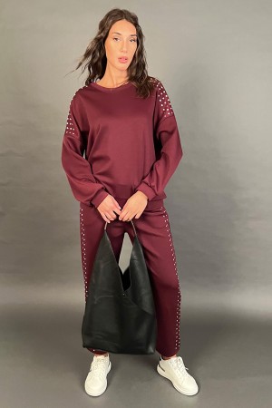 Coordinato Bonny in tuta felpa e pantalone con borchiette argento Coordinato Bonny in tuta felpa e pantalone con borchiette a...