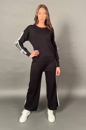 Arco de jersey coordinado con copos y pantalones con bandas laterales 
